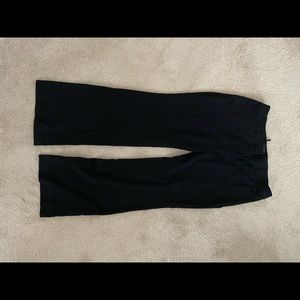 Black dress pants that are boot cut.